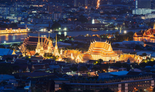 High angle view of illuminated buildings at night