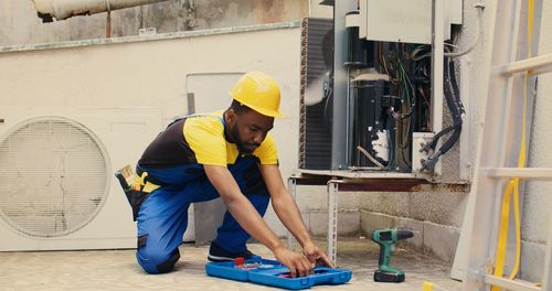 Rear view of man working in gym