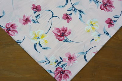 High angle view of pink flower on table