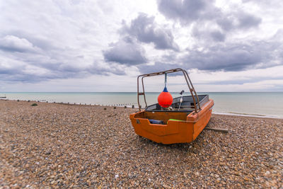 Man on beach against sky