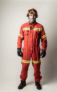 Midsection of man wearing mask against white background