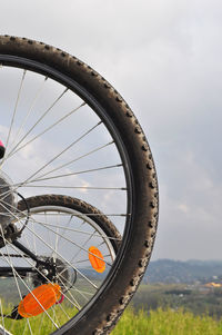 Cropped image of bicycle on field