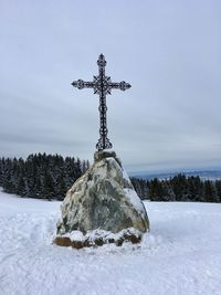 Scenic view of snow covered field against sky / cross / mont bénand / france