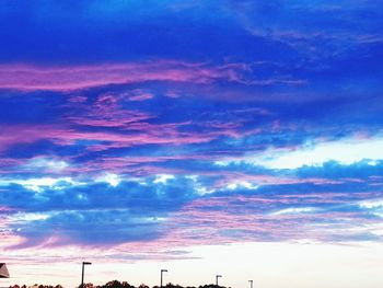 Low angle view of cloudy sky at sunset