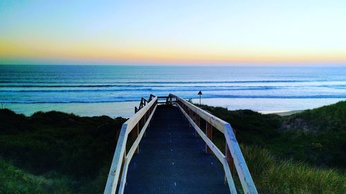 Scenic view of sea against clear sky during sunset