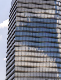 Low angle view of skyscraper against sky