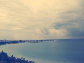 Scenic view of sea against cloudy sky