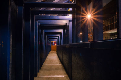 Narrow walkway at night