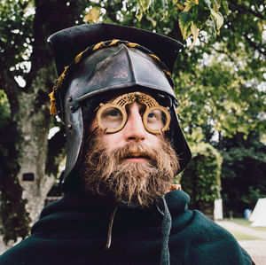 Portrait of man wearing mask against trees