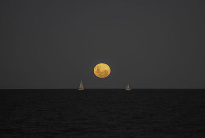 Scenic view of sea against sky at sunset