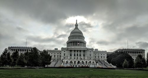 View of  united states capital building against cloudy sky