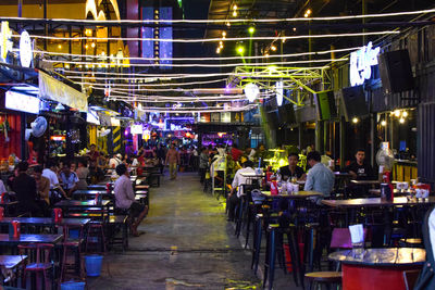 People at market in city at night