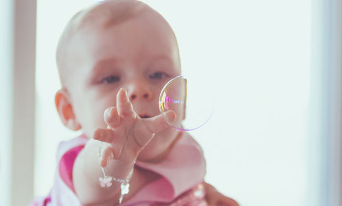 Close-up of girl holding camera