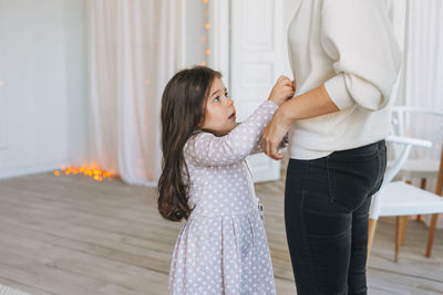 Women standing at home