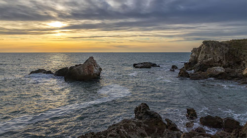 Scenic view of sea against sky during sunset