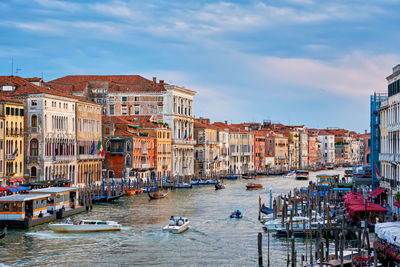 Grand canal with boats and gondolas on sunset, venice, italy