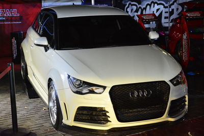 Close-up of car parked on street