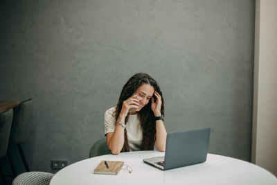 Young girl working at home