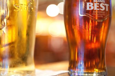 Close-up of beer glass on table