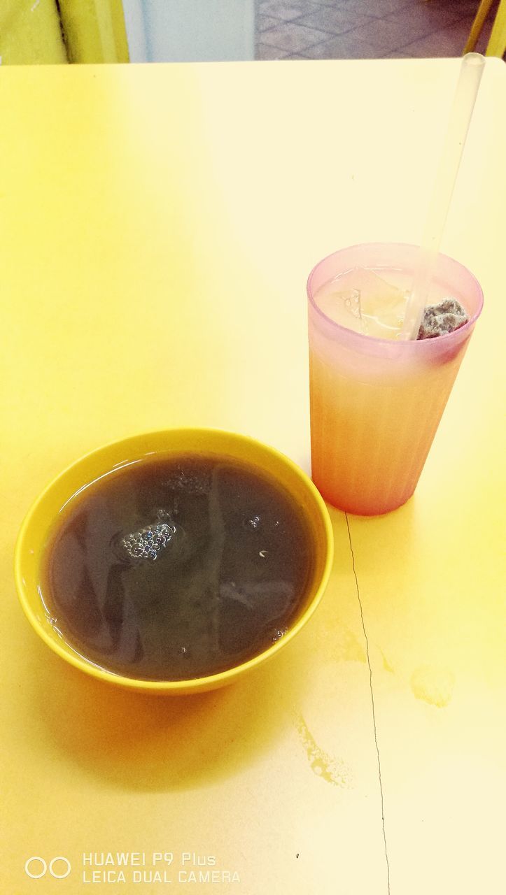 CLOSE-UP OF COFFEE ON TABLE