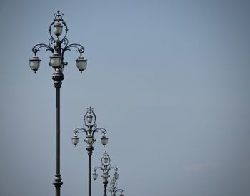 Low angle view of street light against sky