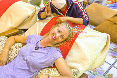 High angle portrait of woman resting at home