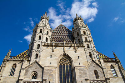 Low angle view of cathedral against blue sky