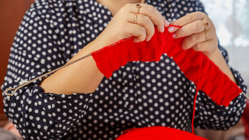 Midsection of woman holding gift