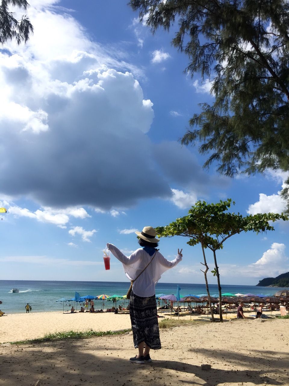 sky, sea, cloud - sky, beach, standing, water, outdoors, nature, day, tree, one person, men, horizon over water, real people, sand, beauty in nature, people, adults only, adult, only men, human body part, one man only