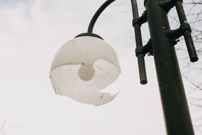 Low angle view of lighting equipment against sky