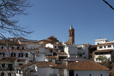 Residential district against clear sky