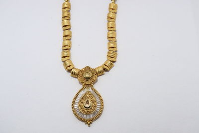 Close-up of cross against white background