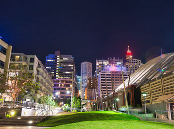 Illuminated buildings in city at night