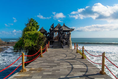 Pier over sea against sky