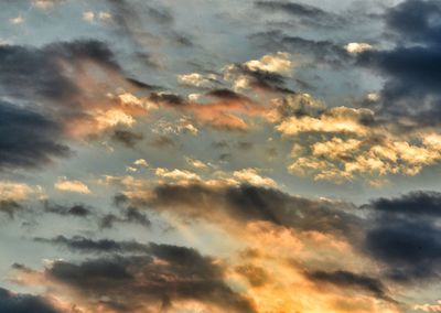 Low angle view of clouds in sky during sunset