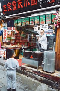 Man standing at market stall