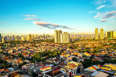 High angle view of modern buildings in city against sky