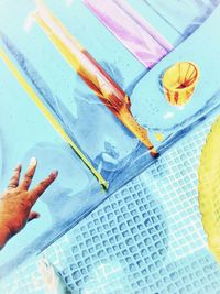 High angle view of person hand holding paper