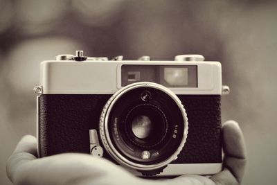 Close-up of hand holding camera