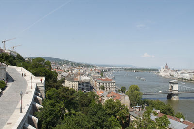 River in town against sky