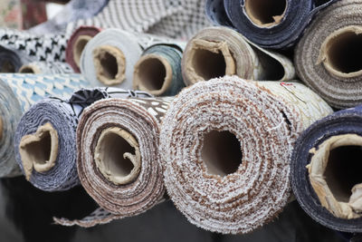 Samples of cloth and fabrics in different colors found at a fabrics market.