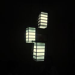 Building seen through window in dark room