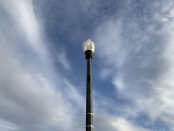 Low angle view of smoke stack against sky