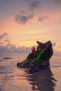 Scenic view of sea against sky during sunset