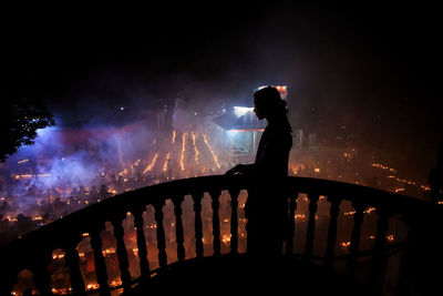 Man standing at night