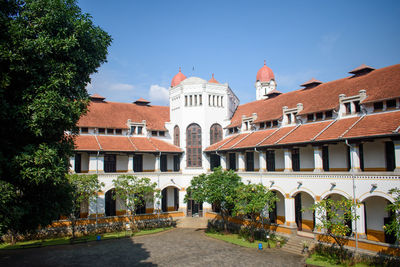 Facade of historic building against sky