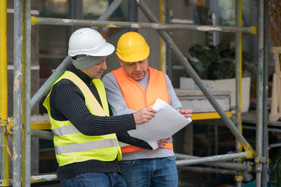 Low angle view of man working at construction site