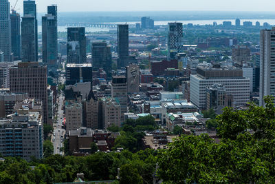 High angle view of buildings in city against sky