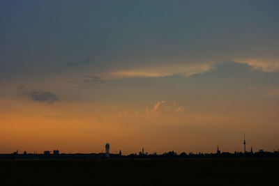 Silhouette landscape against sky at sunset