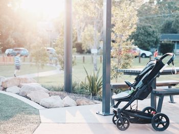 Baby carriage on footpath in park